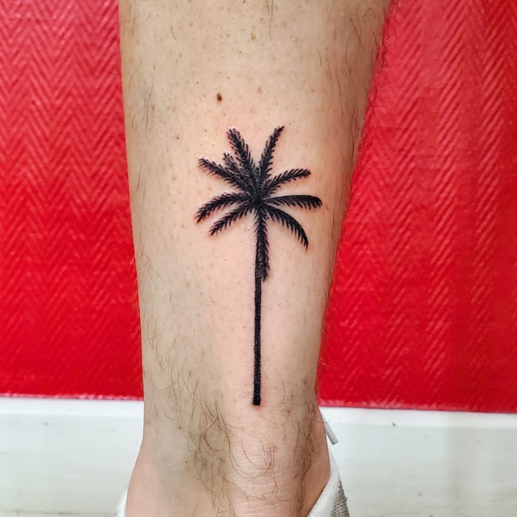 Homme tatouage commun palmier 1
